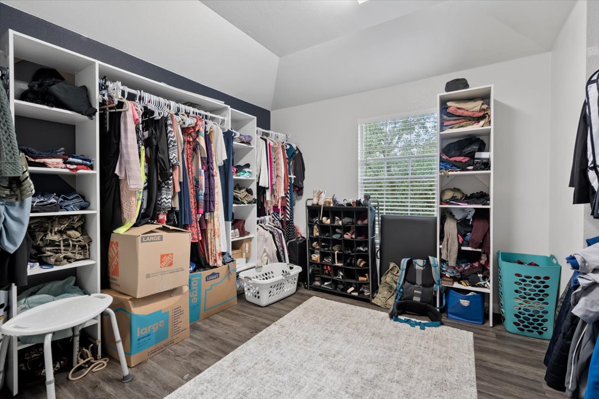 2338 Brookhollow Terrace Georgetown, TX 78626 - Photo 11 of 37 a view of walk in closet with clothes and shoes