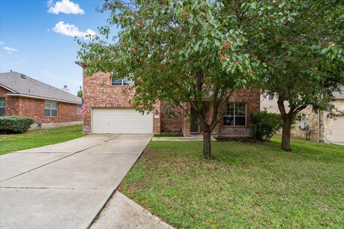 2338 Brookhollow Terrace Georgetown, TX 78626 - Photo 2 of 37 a front view of a house with a yard