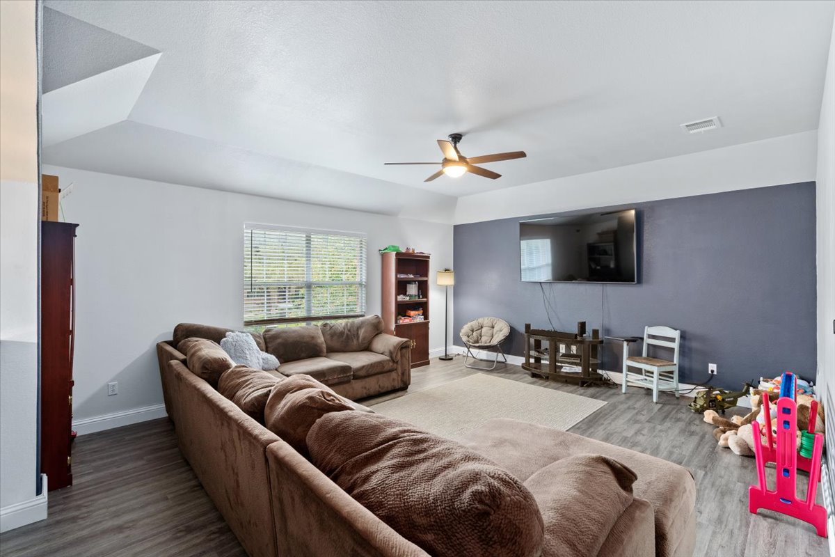 2338 Brookhollow Terrace Georgetown, TX 78626 - Photo 22 of 37 a living room with furniture and a flat screen tv