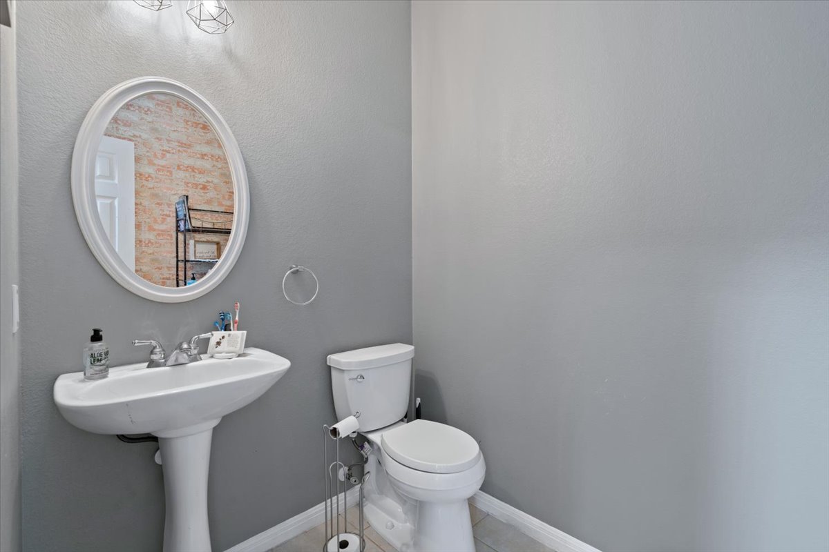2338 Brookhollow Terrace Georgetown, TX 78626 - Photo 25 of 37 a bathroom with a sink and a mirror