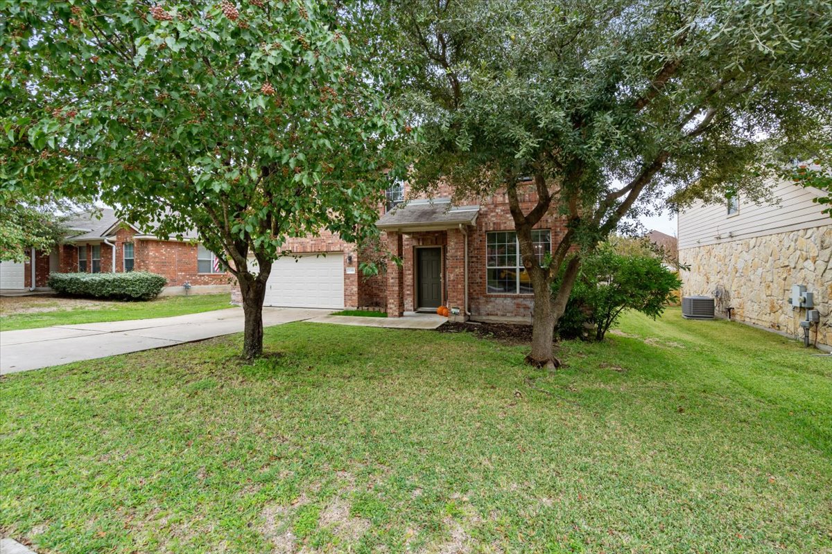 2338 Brookhollow Terrace Georgetown, TX 78626 - Photo 3 of 37 a house with green field in front of it