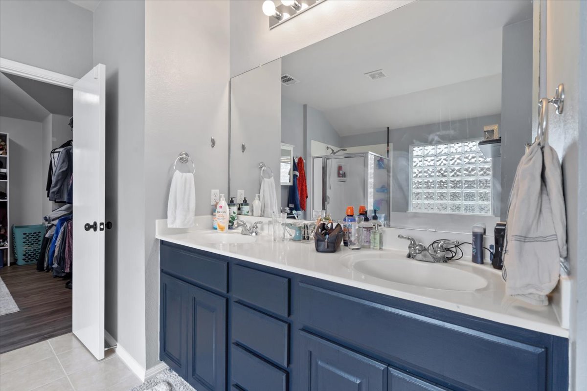 2338 Brookhollow Terrace Georgetown, TX 78626 - Photo 8 of 37 a bathroom with a sink double vanity and a mirror