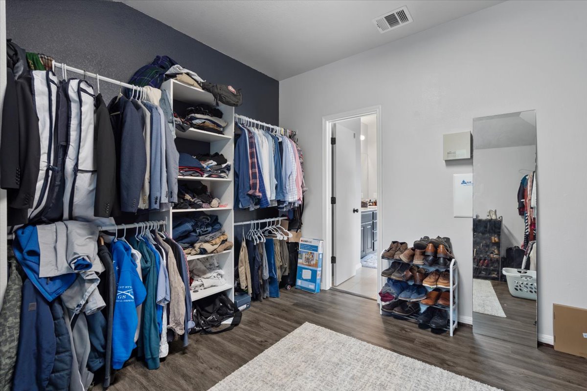 2338 Brookhollow Terrace Georgetown, TX 78626 - Photo 10 of 37 a view of walk in closet with clothes and shoes