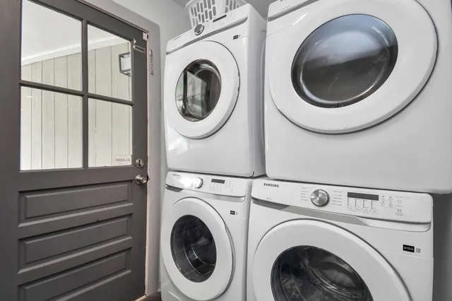 a view of a hallway with washer and dryer