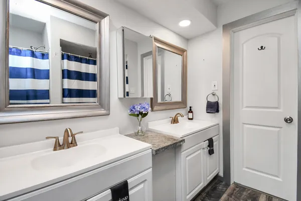 a bathroom with a sink and a mirror