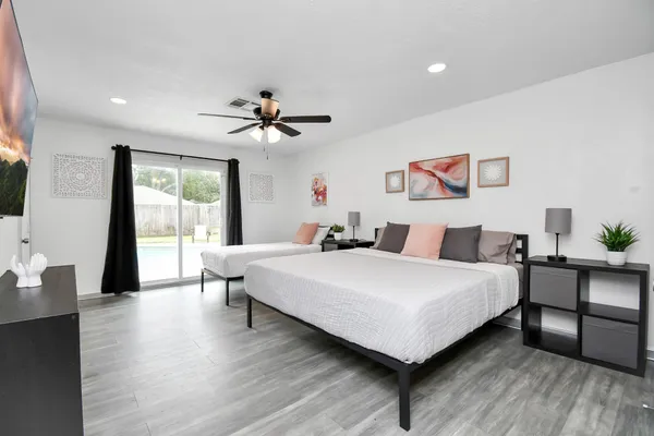 a bedroom with a bed and a table