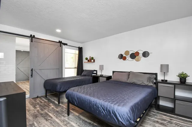 a bedroom with double bed and a window