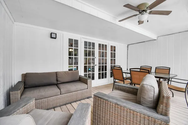 a living room with furniture and a window