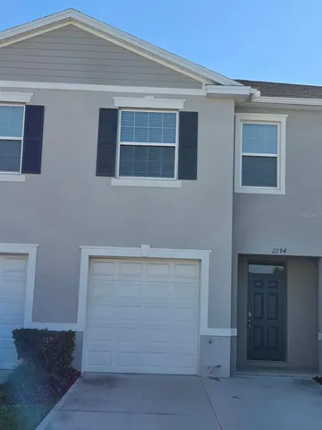 a kitchen with a refrigerator and sink