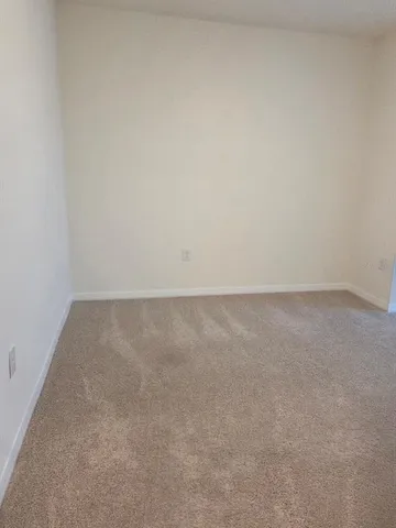 a bathroom with a granite countertop toilet a sink and a bathtub