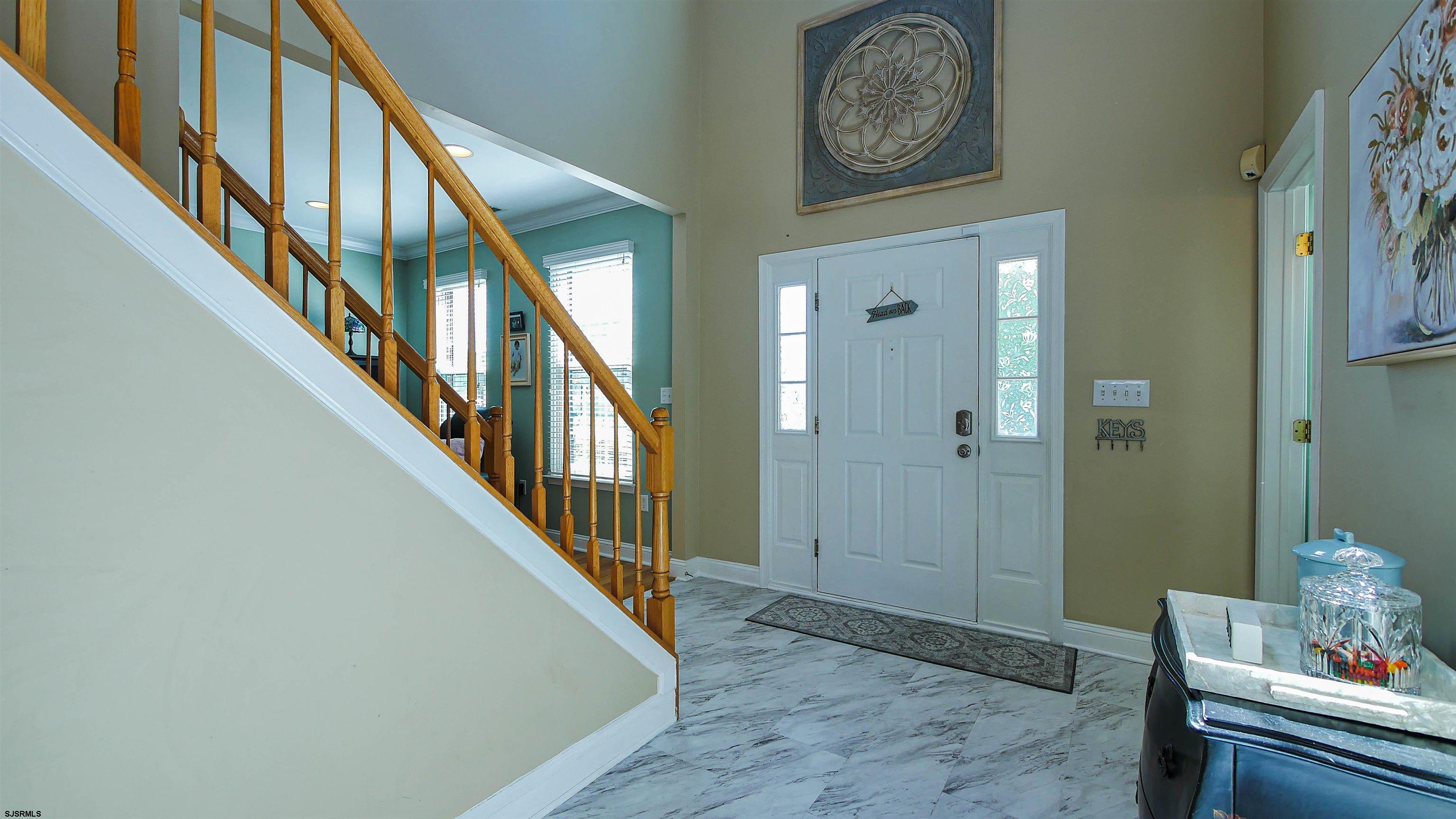 101 Haviv Drive Northfield, NJ 08225 - Photo 14 of 38 a view of entryway with wooden floor