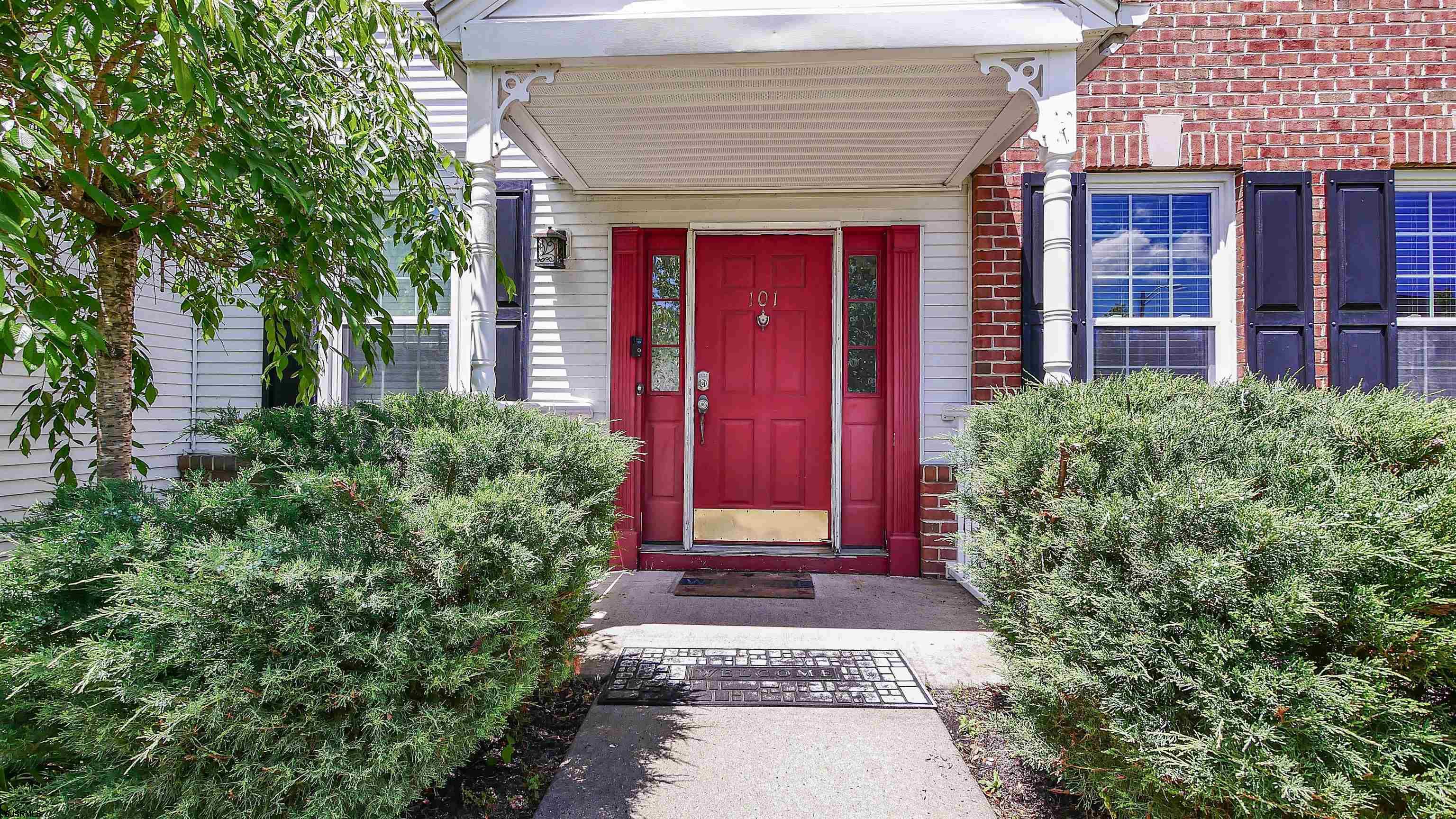 101 Haviv Drive Northfield, NJ 08225 - Photo 2 of 38 a view of a pathway with red door