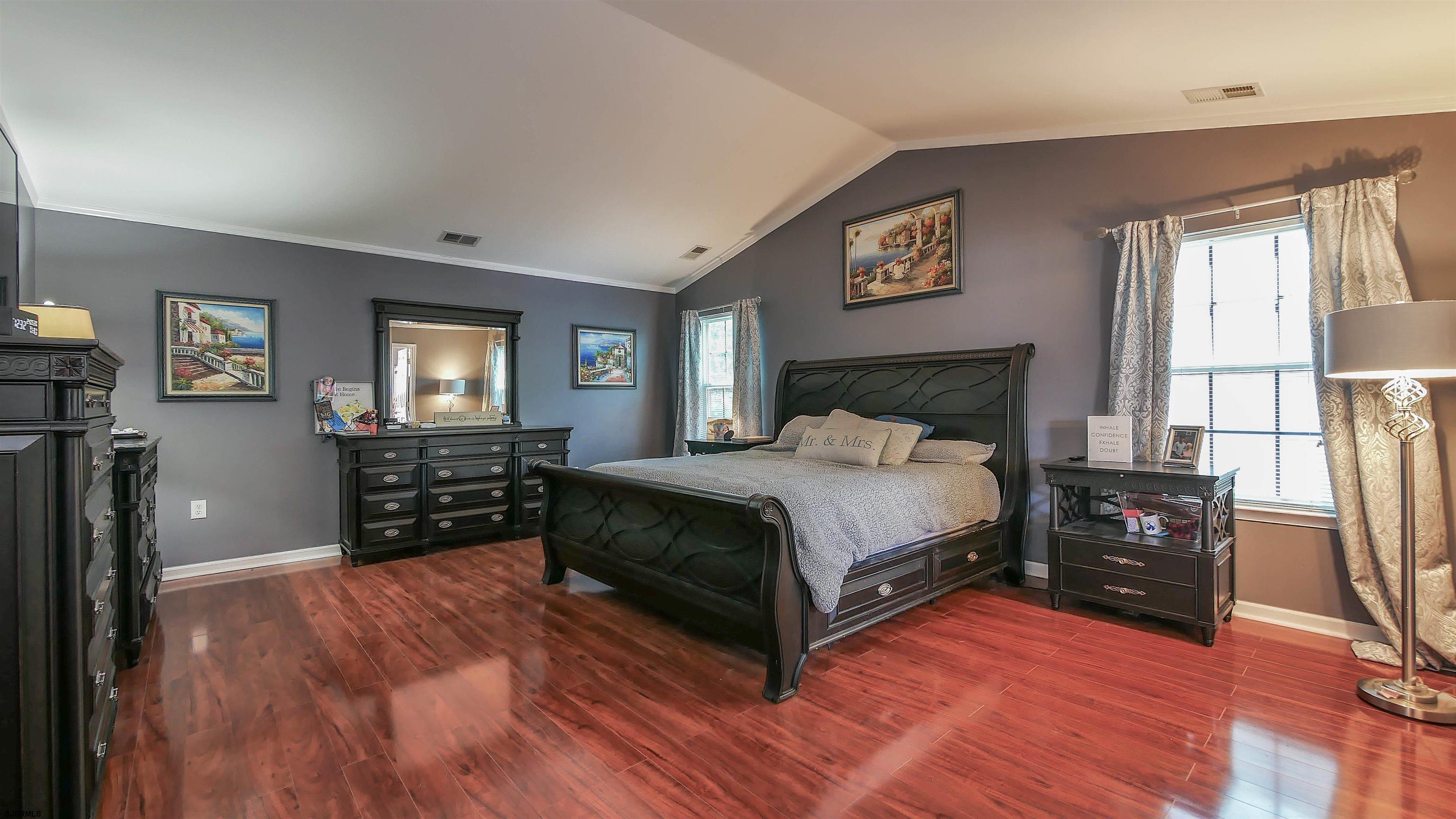 101 Haviv Drive Northfield, NJ 08225 - Photo 21 of 38 a bedroom with a bed window and a television