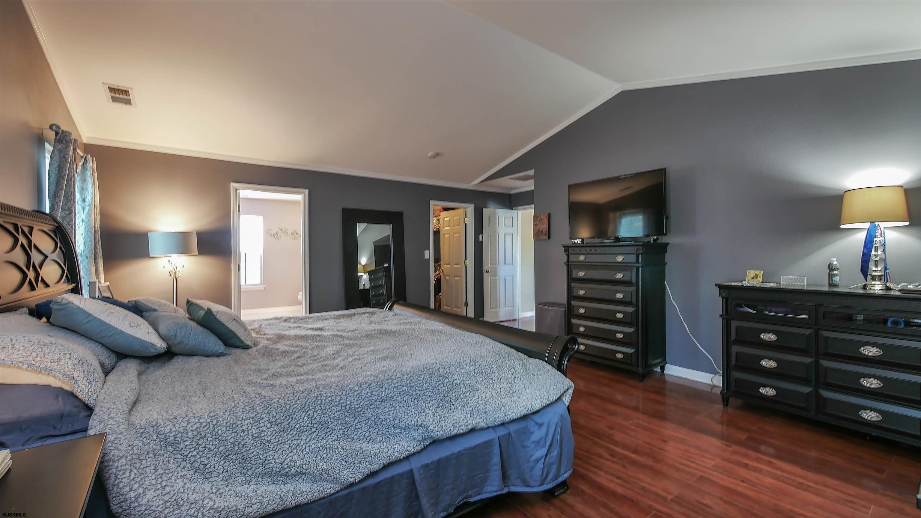 101 Haviv Drive Northfield, NJ 08225 - Photo 23 of 38 a bedroom with a bed and furniture