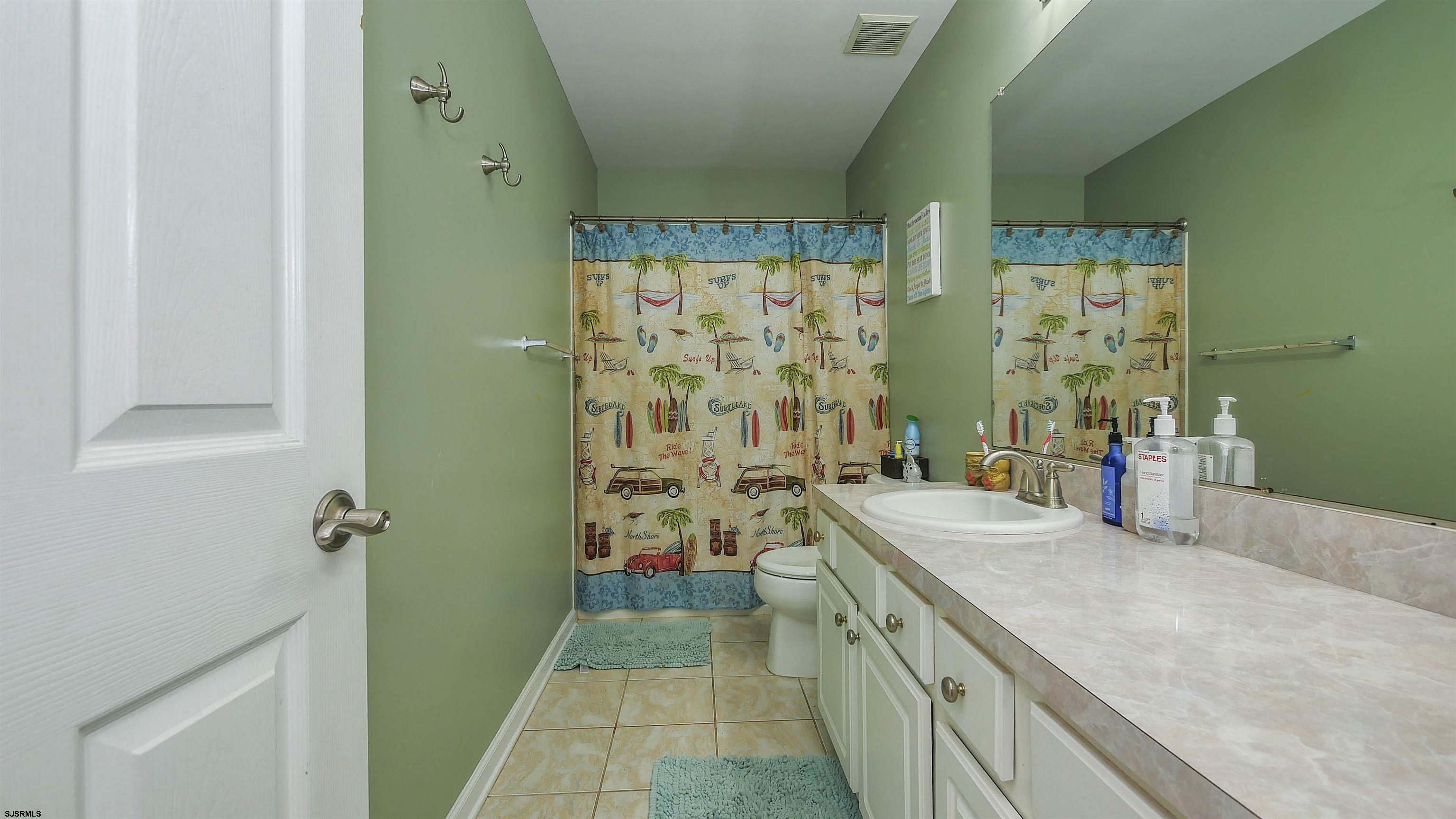 101 Haviv Drive Northfield, NJ 08225 - Photo 27 of 38 a spacious bathroom with a granite countertop sink a toilet and shower