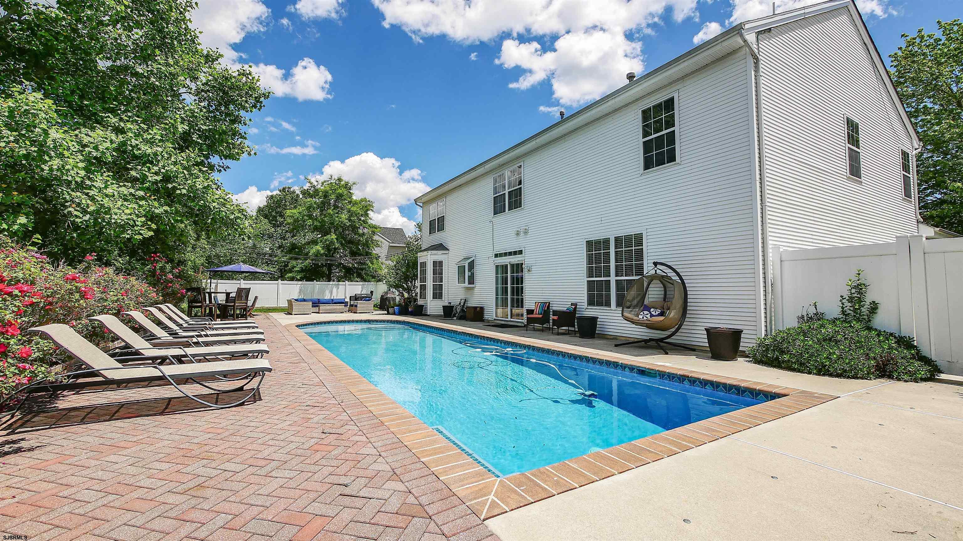 101 Haviv Drive Northfield, NJ 08225 - Photo 31 of 38 a view of a house with backyard and sitting area