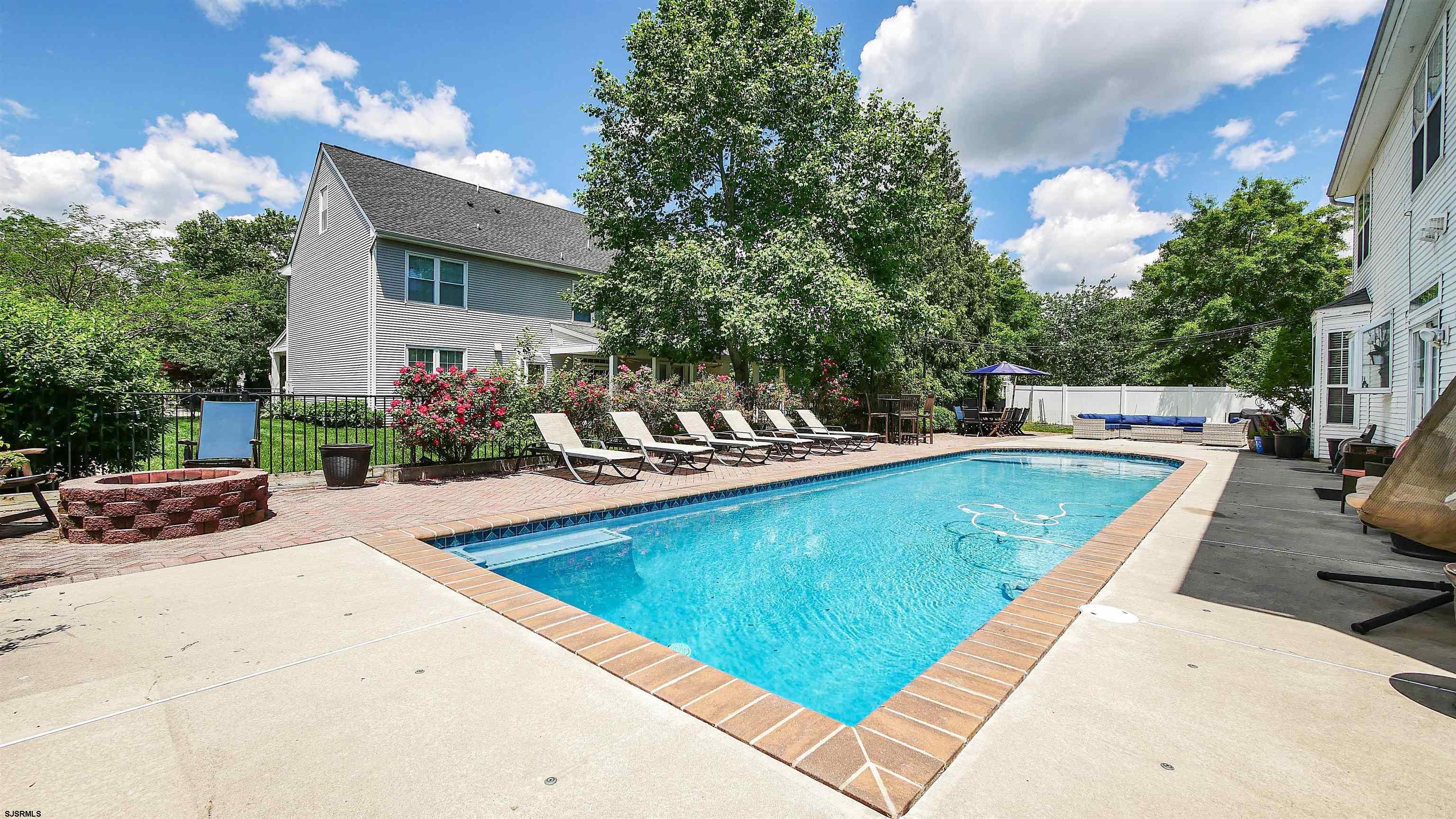101 Haviv Drive Northfield, NJ 08225 - Photo 32 of 38 a view of swimming pool with outdoor seating and a patio