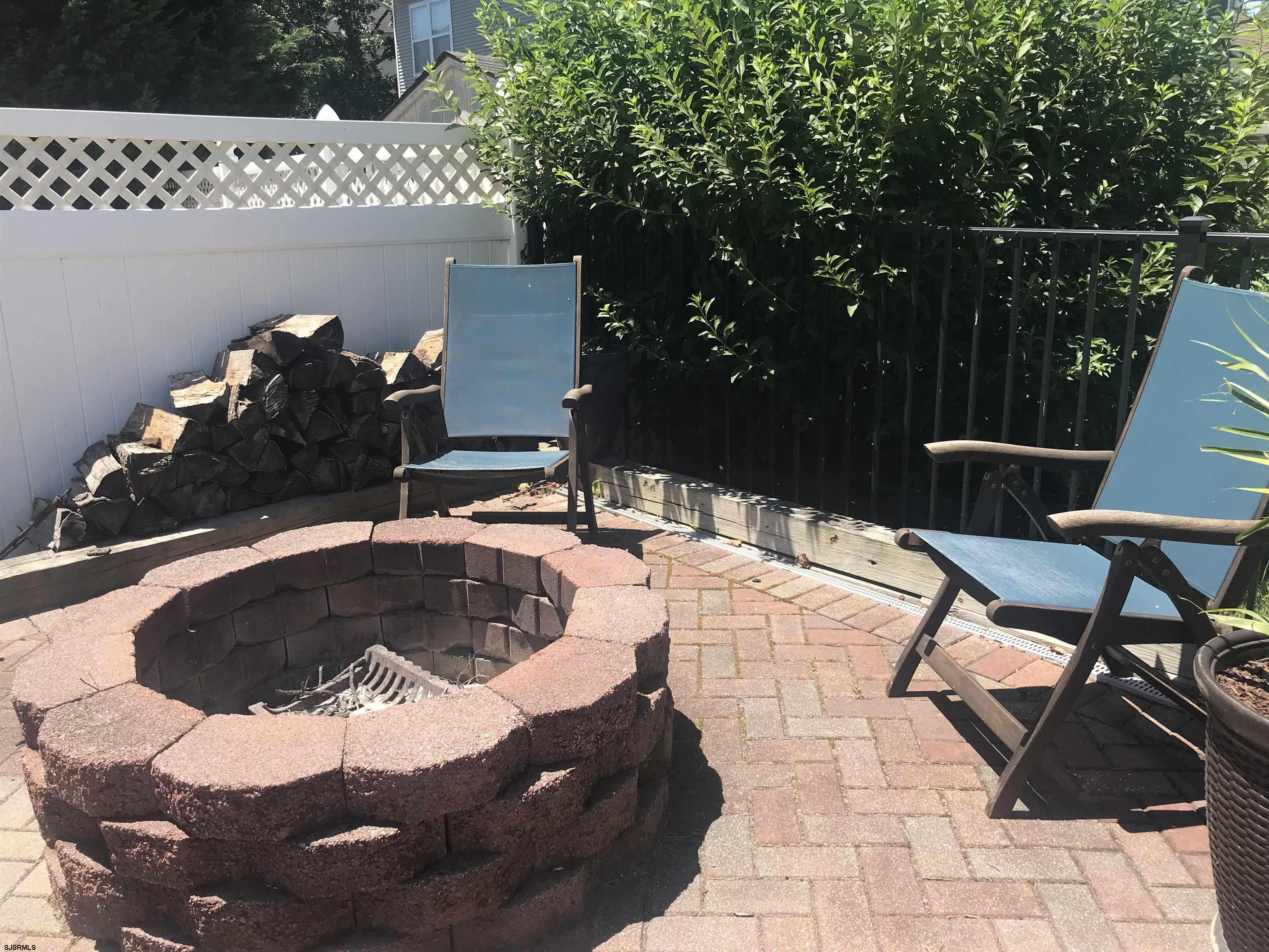 101 Haviv Drive Northfield, NJ 08225 - Photo 35 of 38 a table and chairs in a patio