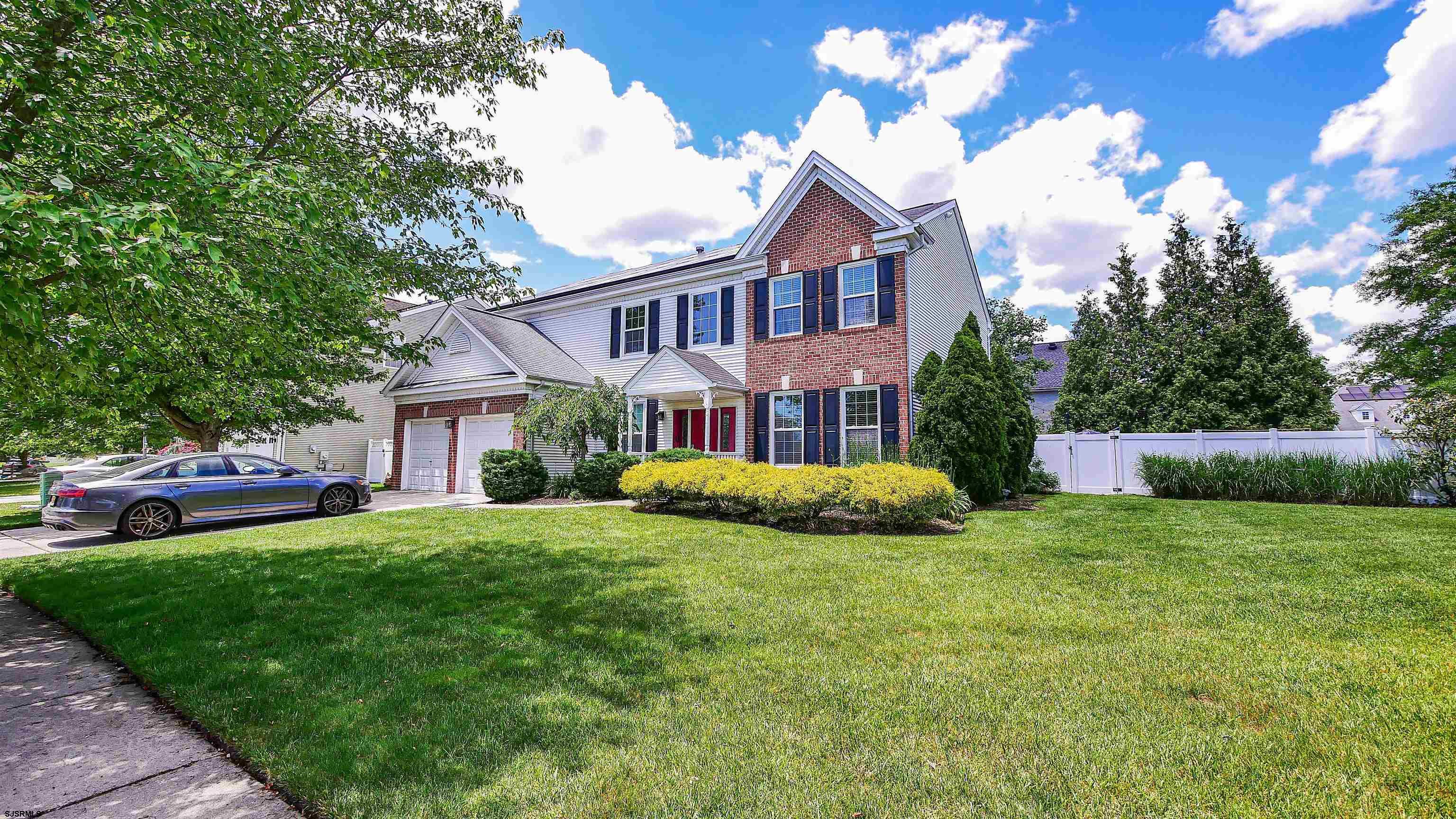 101 Haviv Drive Northfield, NJ 08225 - Photo 36 of 38 a view of a house with a big yard plants and large trees
