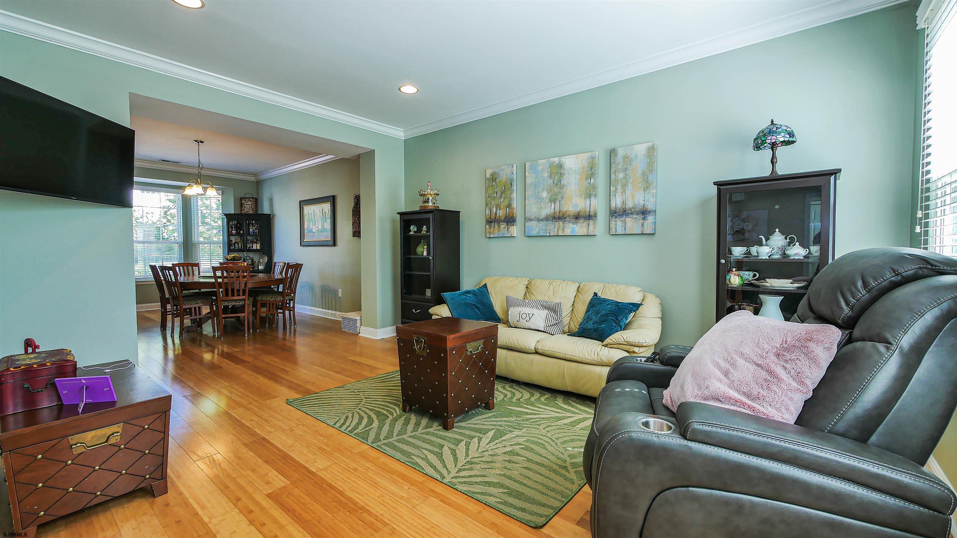 101 Haviv Drive Northfield, NJ 08225 - Photo 4 of 38 a living room with furniture and a flat screen tv