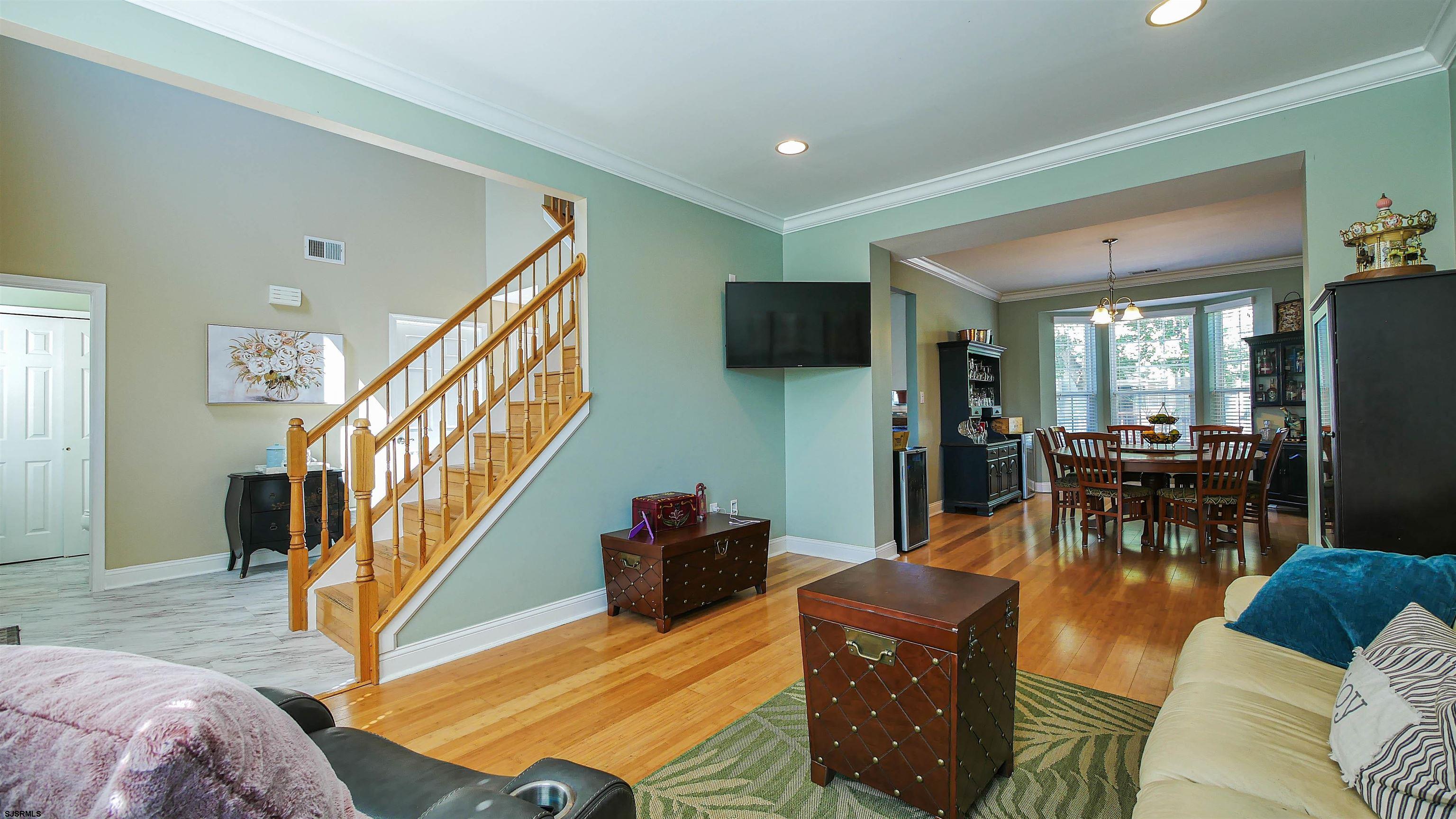 101 Haviv Drive Northfield, NJ 08225 - Photo 5 of 38 a living room with furniture and a flat screen tv