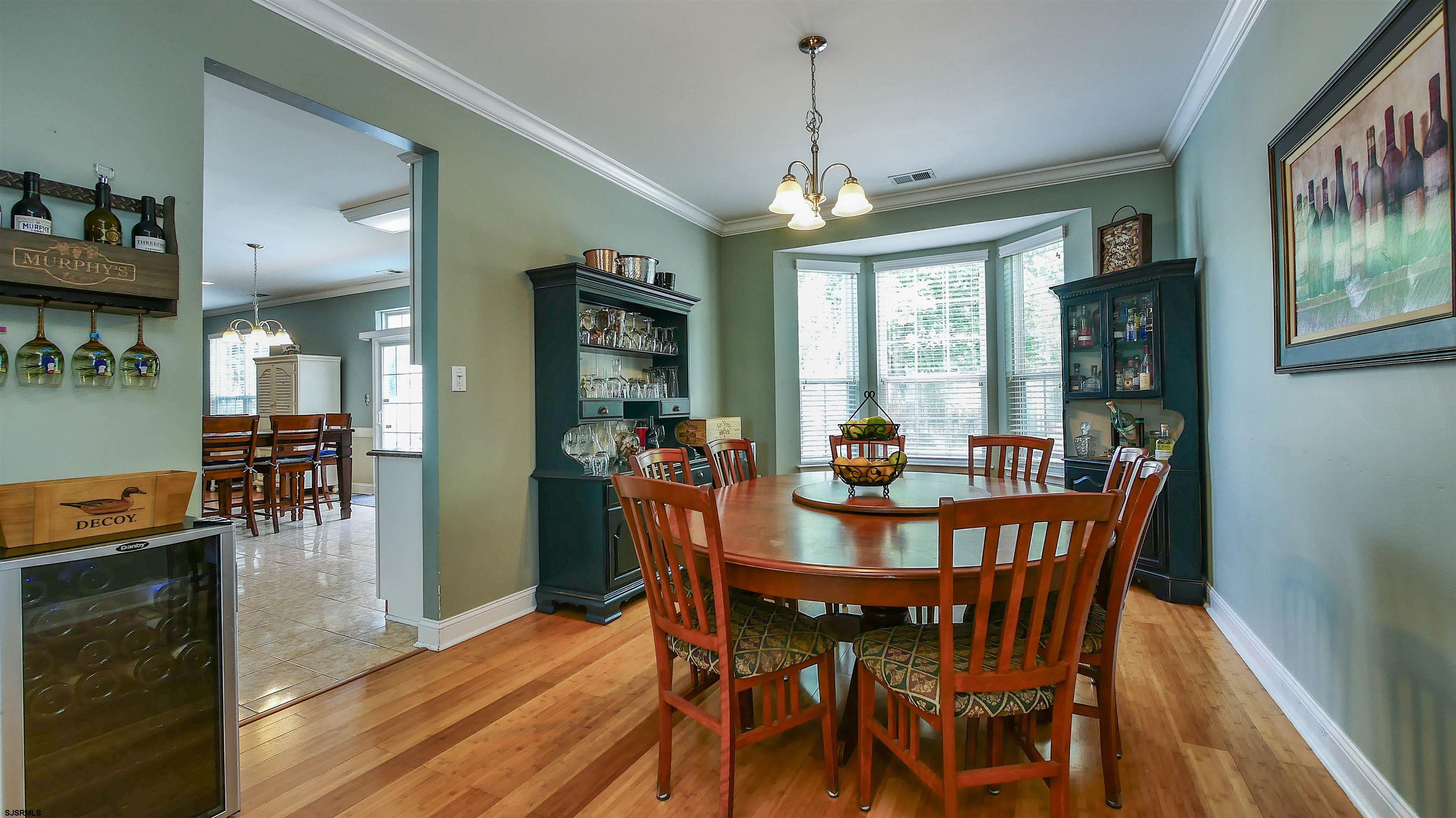 101 Haviv Drive Northfield, NJ 08225 - Photo 6 of 38 a view of a dining room with furniture window and wooden floor
