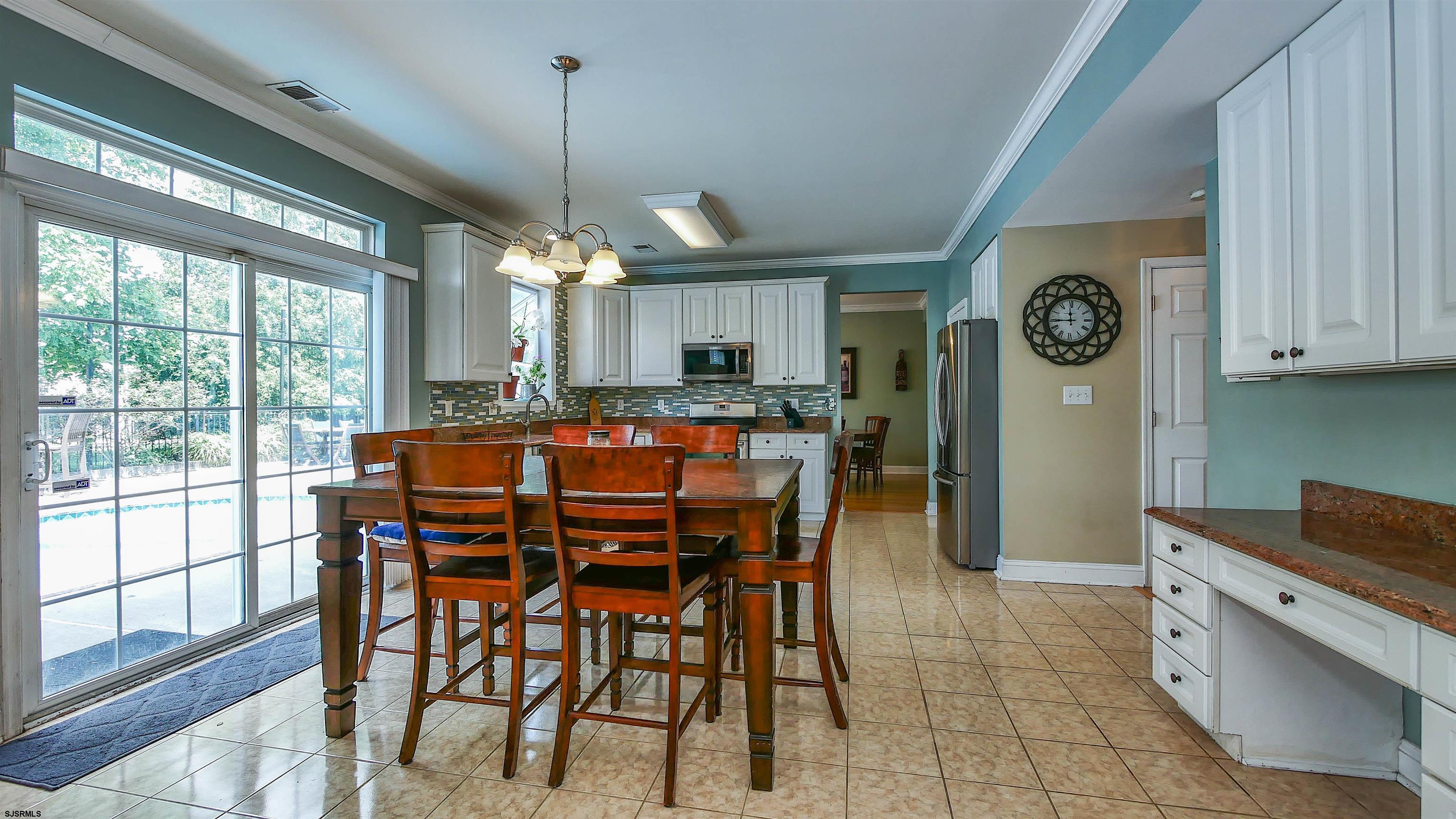 101 Haviv Drive Northfield, NJ 08225 - Photo 9 of 38 a dining room with furniture and window