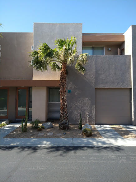 225 Sandy Point Trail Palm Springs, CA 92262 - Photo 1 of 38 a front view of a house with a yard and garage
