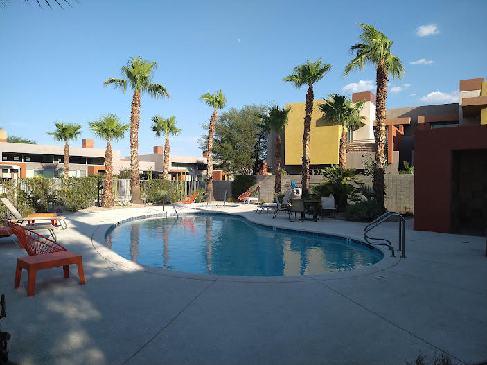 225 Sandy Point Trail Palm Springs, CA 92262 - Photo 17 of 38 a view of a swimming pool with a lounge chairs