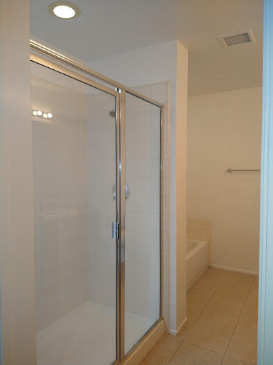 225 Sandy Point Trail Palm Springs, CA 92262 - Photo 30 of 38 a bathroom with a glass shower door