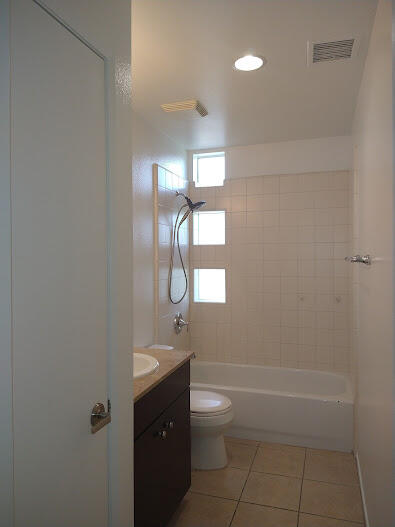 225 Sandy Point Trail Palm Springs, CA 92262 - Photo 34 of 38 a bathroom with a toilet a sink and mirror