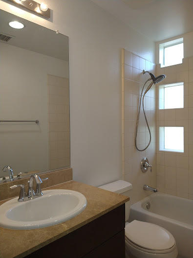 225 Sandy Point Trail Palm Springs, CA 92262 - Photo 36 of 38 a bathroom with a granite countertop sink toilet and shower