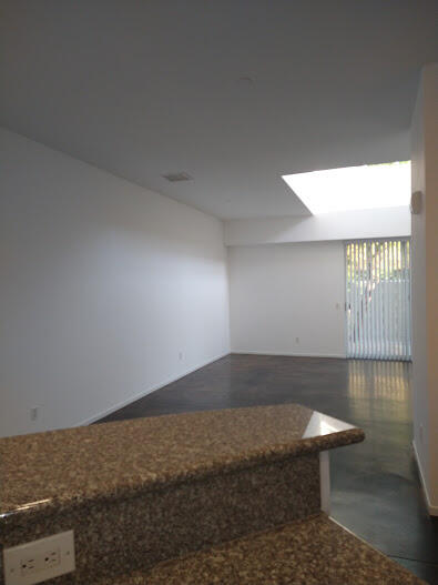 225 Sandy Point Trail Palm Springs, CA 92262 - Photo 37 of 38 a view of wooden floor and windows in a room