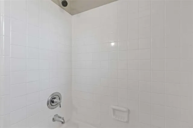 a close view of a shower in bathroom