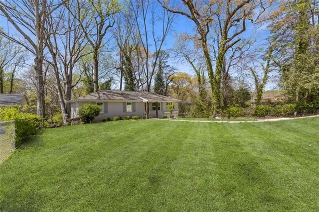 a view of a house with a yard