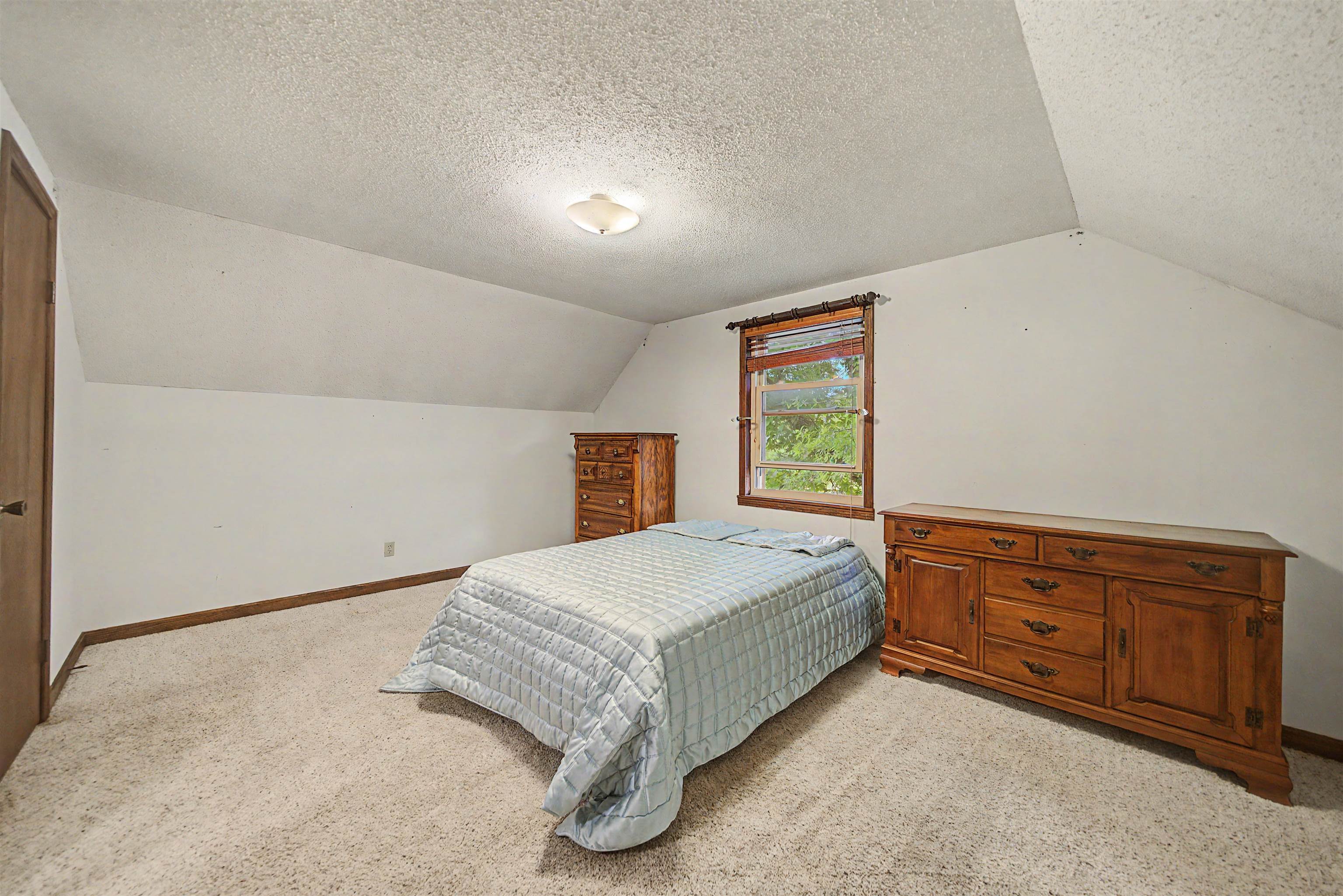 12 Baker Road Selmer, TN 38375 - Photo 26 of 28 a bedroom with a bed and window