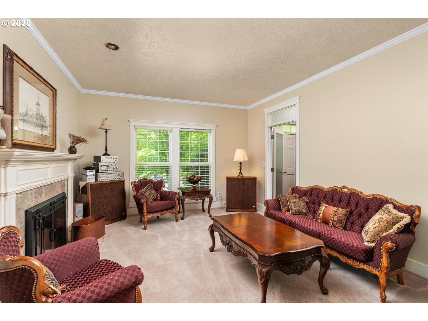 16042 Southwest Waxwing Way Beaverton, OR 97007 - Photo 18 of 48 a living room with furniture a fireplace and a large window