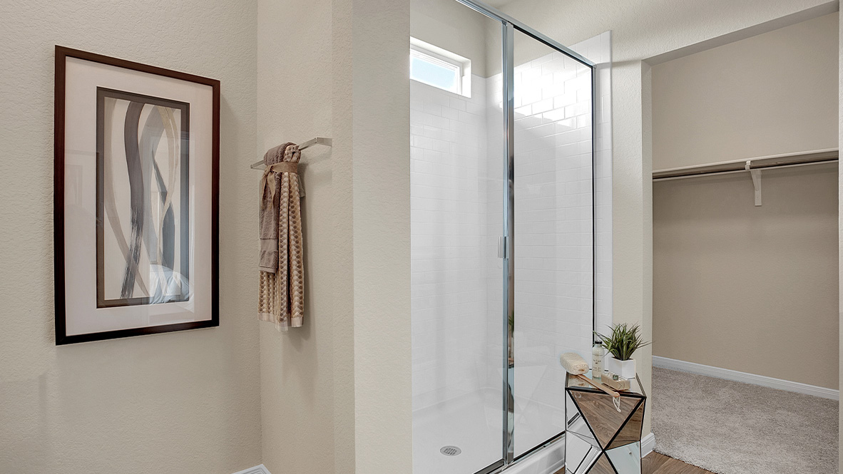121 Little Walnut Cove Kyle, TX 78640 - Photo 14 of 31 a view of a bathroom with a glass door and a window
