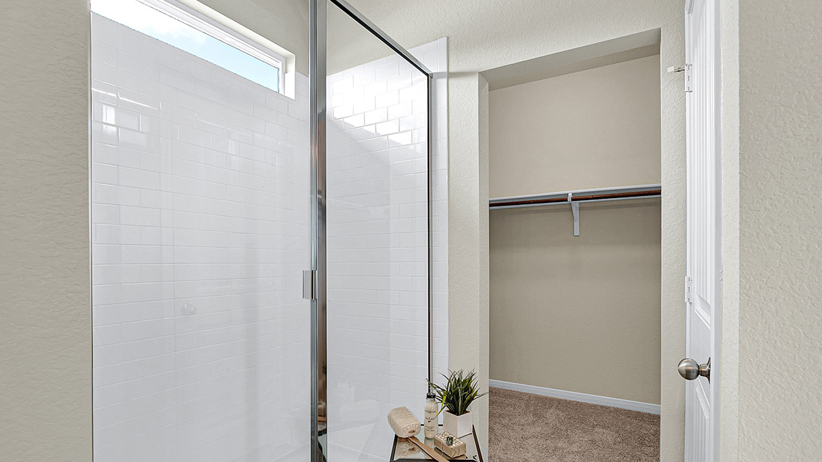 121 Little Walnut Cove Kyle, TX 78640 - Photo 15 of 31 a bathroom with a glass shower door