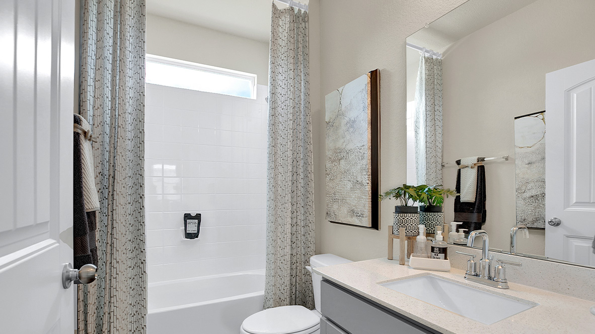 121 Little Walnut Cove Kyle, TX 78640 - Photo 16 of 31 a bathroom with a granite countertop sink toilet and shower