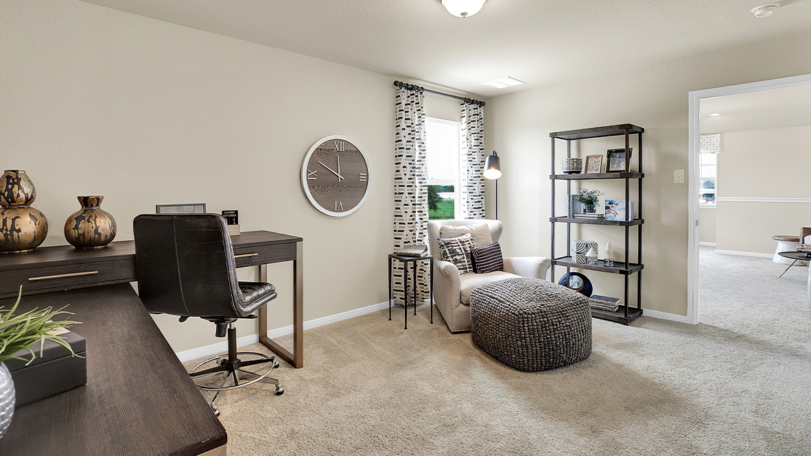 121 Little Walnut Cove Kyle, TX 78640 - Photo 24 of 31 a living room with furniture a clock and a large window