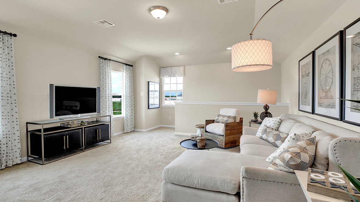 121 Little Walnut Cove Kyle, TX 78640 - Photo 25 of 31 a living room with furniture and a flat screen tv