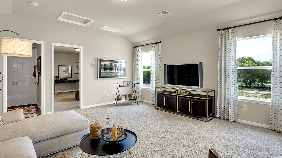121 Little Walnut Cove Kyle, TX 78640 - Photo 27 of 31 a living room with furniture and a flat screen tv