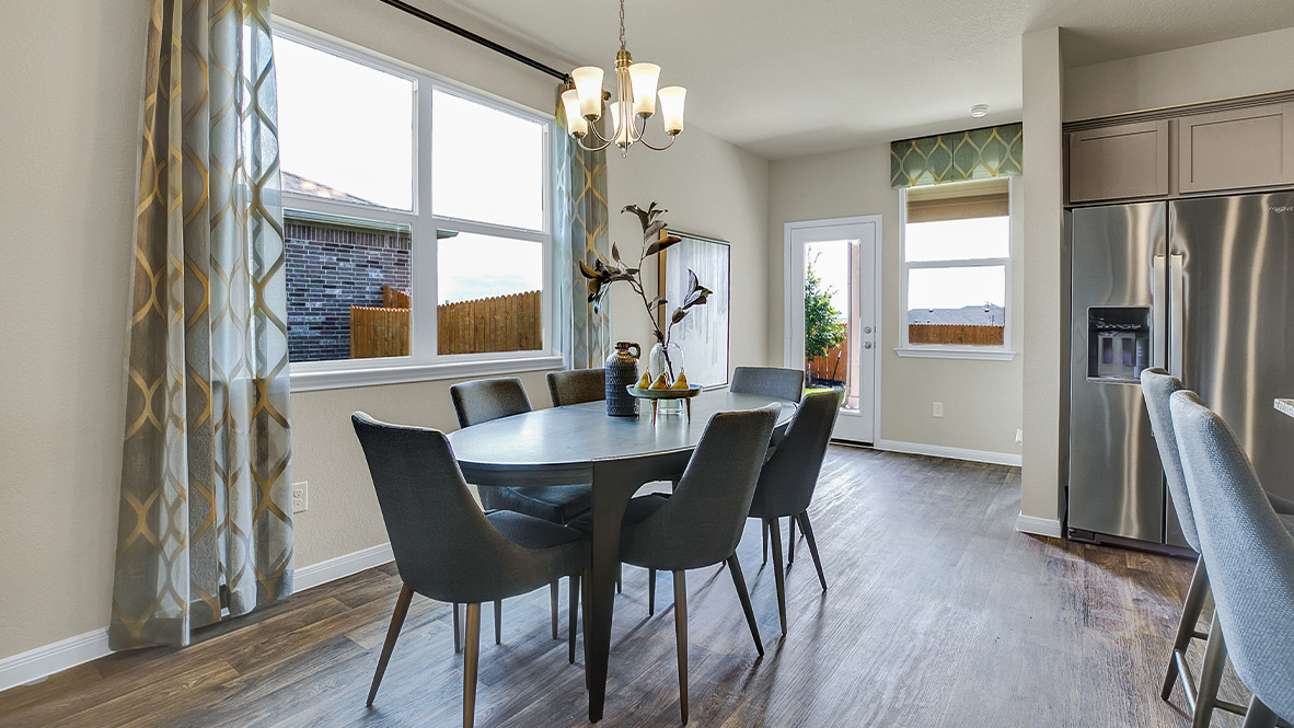 121 Little Walnut Cove Kyle, TX 78640 - Photo 3 of 31 a view of a dining room with furniture window and wooden floor