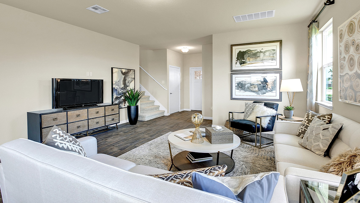 121 Little Walnut Cove Kyle, TX 78640 - Photo 5 of 31 a living room with furniture and a flat screen tv