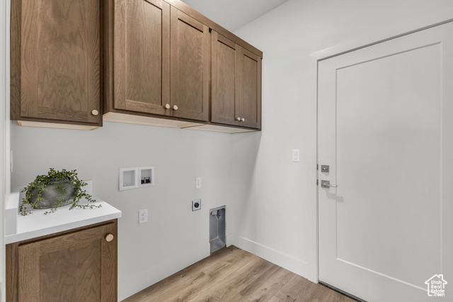 155 East 360th Street East, Unit 10B Fillmore, UT 84631 - Photo 32 of 43 Laundry area featuring cabinets, hookup for a washing machine, light hardwood / wood-style floors, and hookup for an electric dryer