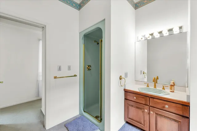 a spacious bathroom with a double vanity sink and mirror