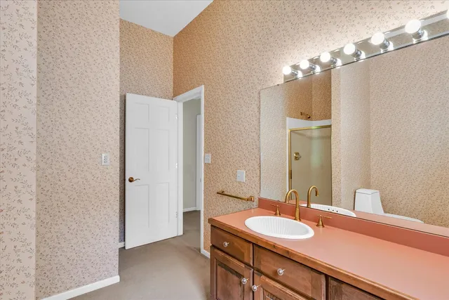 a bathroom with a sink and a mirror