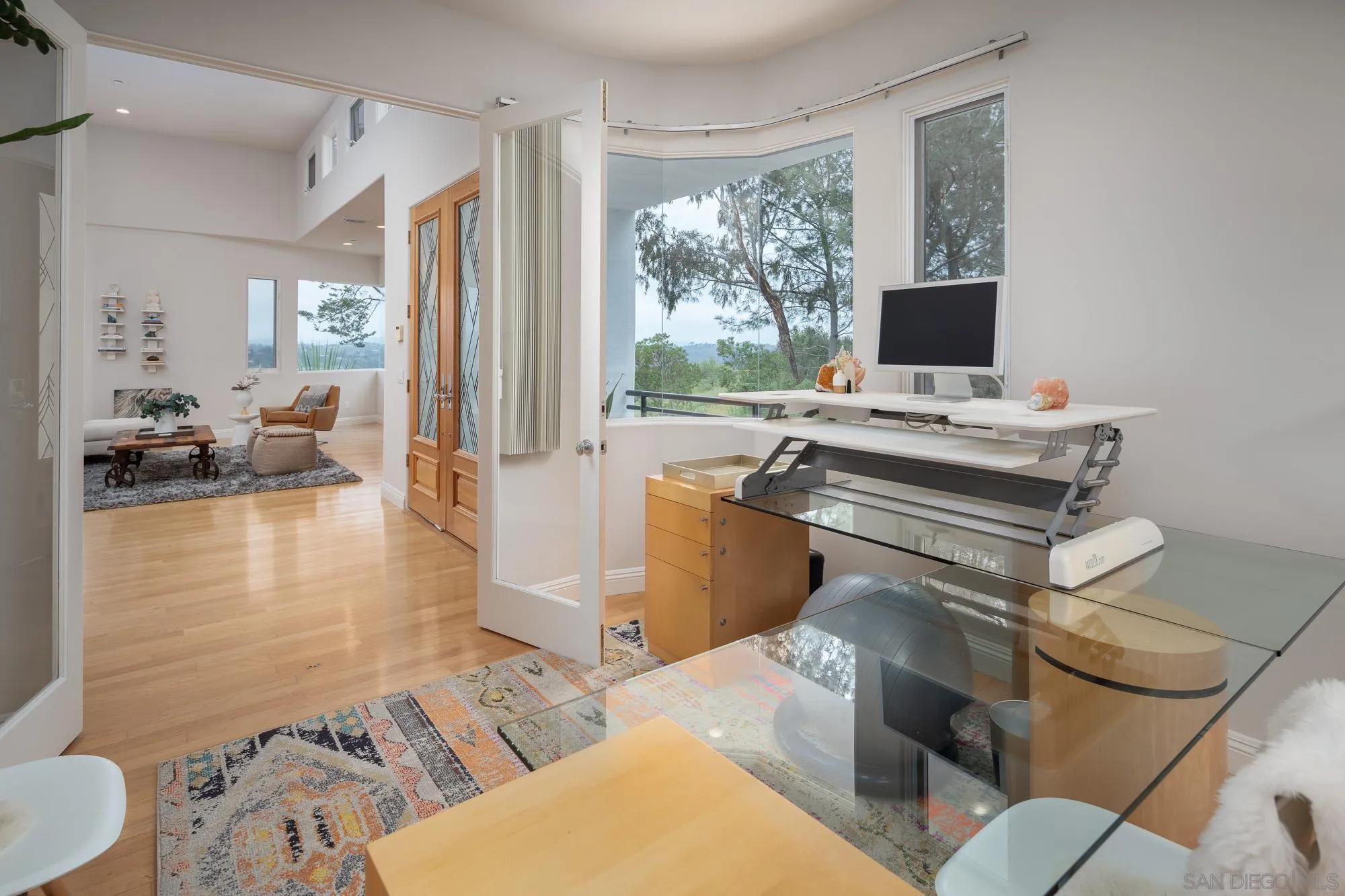 1953 Crest Drive Encinitas, CA 92024 - Photo 18 of 42 a view of a workspace with furniture and a window