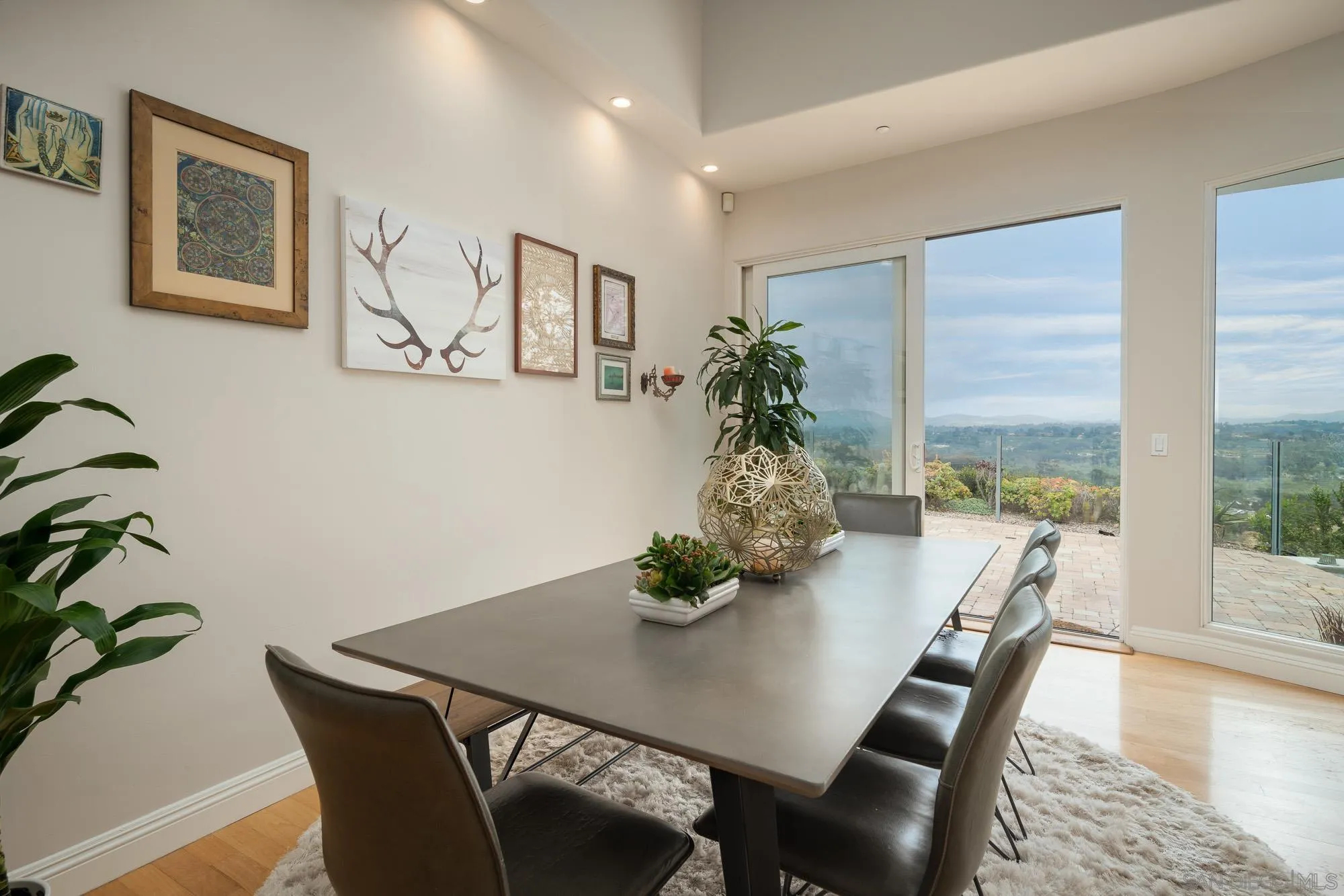 1953 Crest Drive Encinitas, CA 92024 - Photo 21 of 42 a dining room with furniture and wooden floor